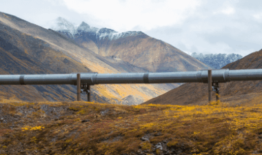CO₂ transport pipeline crossing a mountainous landscape, illustrating critical infrastructure supporting carbon capture, transport, and CCUS reliability - Novatech blog
